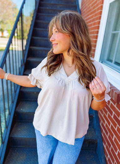 Puff sleeve top with ruffle detailing