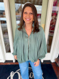Green gathered hem jacket with gold zipper