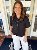 Solid black top with gold buttons on the front 